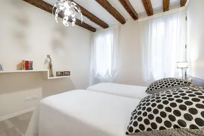 Letto o letti in una camera di Ca' Fosca Home - Campo Santa Fosca by Wonderful Italy
