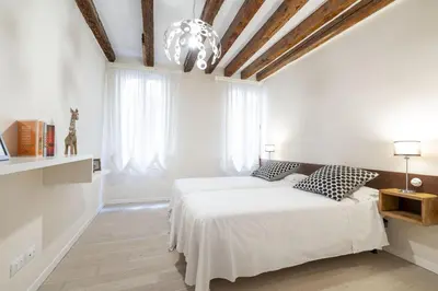 Letto o letti in una camera di Ca' Fosca Home - Campo Santa Fosca by Wonderful Italy