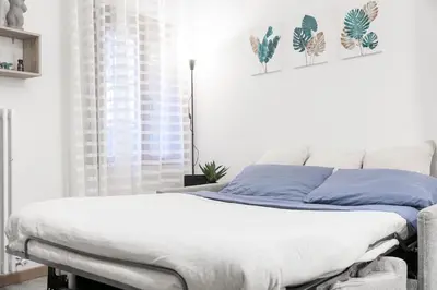 Letto o letti in una camera di Ca' Latina - Cozy home in pieno centro storico