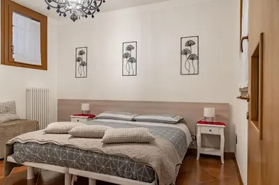Letto o letti in una camera di Ca' Latina - Cozy home in pieno centro storico