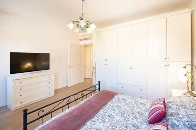 Letto o letti in una camera di Ricco di comfort, grande, luminoso e comodo