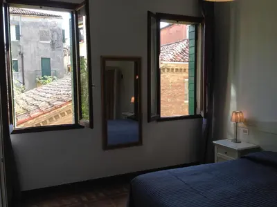 Letto o letti in una camera di Corte Loredana