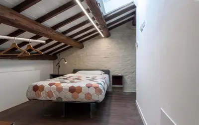 Letto o letti in una camera di Palazzo '900 Design Flats - L'Orto
