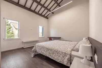 Letto o letti in una camera di Palazzo '900 Design Flats - L'Orto