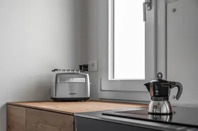 Cucina o angolo cottura di Palazzo '900 Design Flats - Il Prato