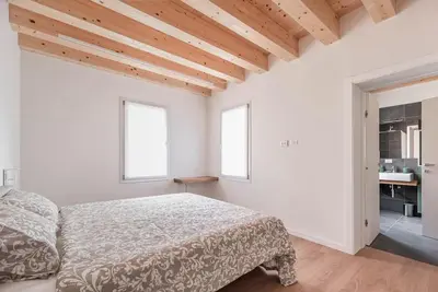 Letto o letti in una camera di Palazzo '900 Design Flats - Il Gran Salone
