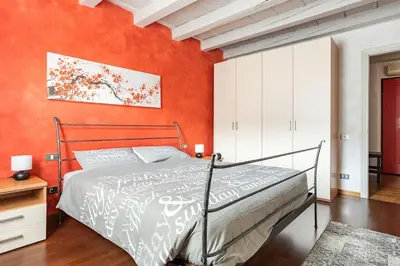 Letto o letti in una camera di Residence dei Frutti pieno centro - Il Melograno
