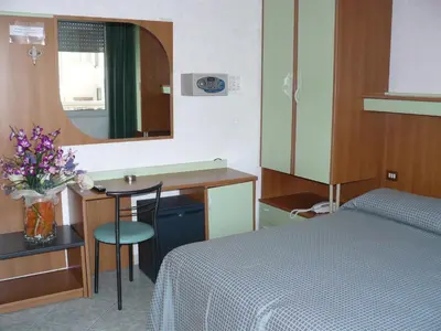 Letto o letti in una camera di Hotel Baviera