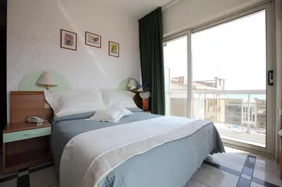 Letto o letti in una camera di Hotel Baviera