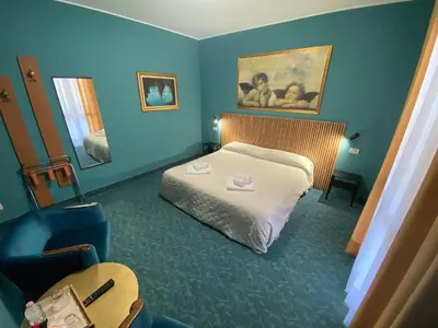 Letto o letti in una camera di Hotel Rey's