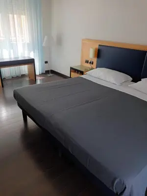 Letto o letti in una camera di Luxury Rooms Padova Station