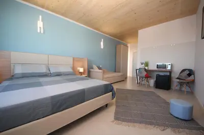 Letto o letti in una camera di Ohana Holiday Rooms