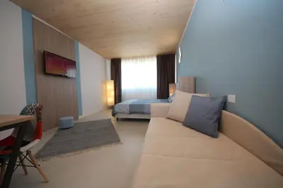 TV o dispositivi per l'intrattenimento presso Ohana Holiday Rooms