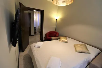 Letto o letti in una camera di CENTRAL AND SPACIOUS APARTMENT