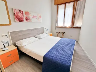 Letto o letti in una camera di BUNGALOW CAVALLINO LIDO