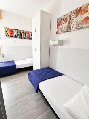 Letto o letti in una camera di BUNGALOW CAVALLINO LIDO