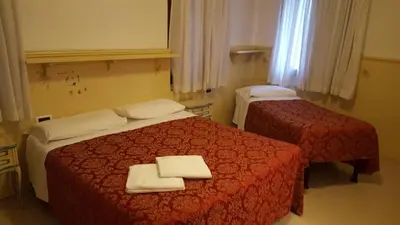 Letto o letti in una camera di Alloggi Gerotto Calderan 2