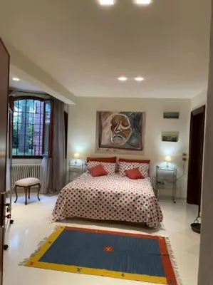 Letto o letti in una camera di il loggiato 1