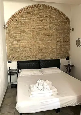Letto o letti in una camera di Casa Manuela non turisti ma ospiti