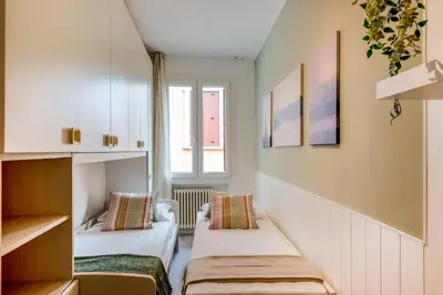 Letto o letti in una camera di GuestHost - Essential Apartment a 5 min da Piazza dei Signori