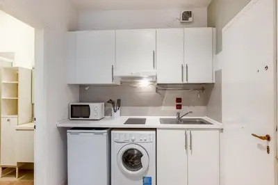Cucina o angolo cottura di GuestHost - Essential Apartment a 5 min da Piazza dei Signori