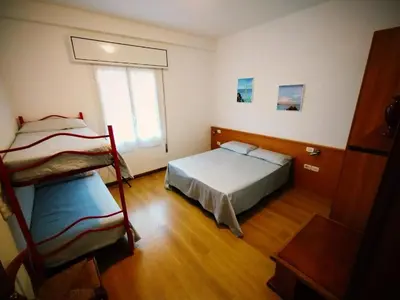 Letto o letti in una camera di Villa Rosa