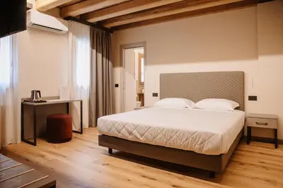 Letto o letti in una camera di Ca'Lisel