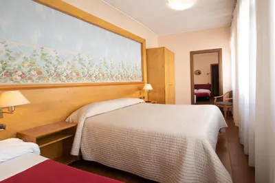 Letto o letti in una camera di Residence La Fenice