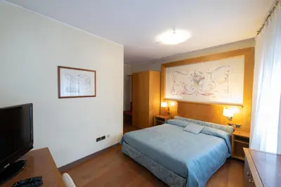 Letto o letti in una camera di Residence La Fenice