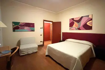Letto o letti in una camera di Residence La Fenice