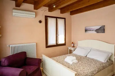 Letto o letti in una camera di Ca' Tintoretto