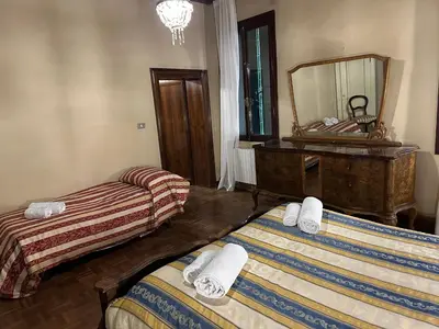 Letto o letti in una camera di 1 Ramo Grimani