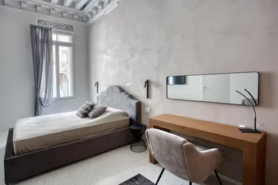 Letto o letti in una camera di Palazzo Bonvicini 10
