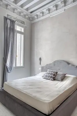 Letto o letti in una camera di Palazzo Bonvicini 10