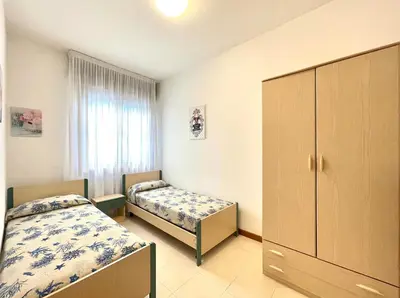 Letto o letti in una camera di Palazzo Masotto - Carraro Immobiliare - Family Apartments