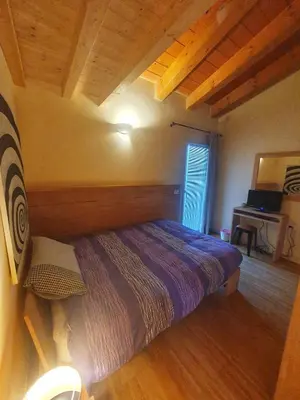 Letto o letti in una camera di Il Camino Rosso