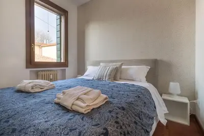 Letto o letti in una camera di enJoy Home - Bilocale sulle Riviere nel cuore di Padova