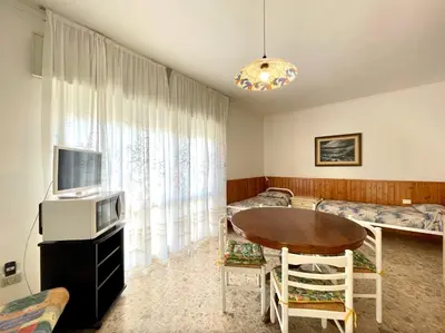 TV o dispositivi per l'intrattenimento presso Appartamenti Fronte Mare CC - Carraro Immobiliare - Family Apartments
