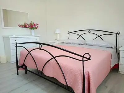 Letto o letti in una camera di Domus Anna