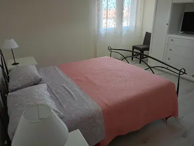 Letto o letti in una camera di Domus Anna