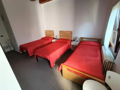 Letto o letti in una camera di Il Nido - Villetta in posizione strategica