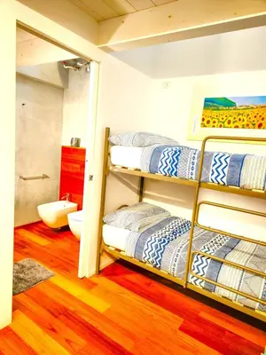 Letto o letti in una camera di APPARTAMENTO INCANTEVOLE A DUE PASSI DAL MARE