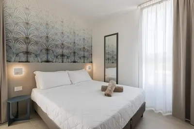 Letto o letti in una camera di Appartamento SevenAir