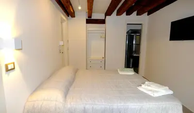 Letto o letti in una camera di Ca' Nostra