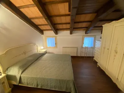 Letto o letti in una camera di Casa Rossa