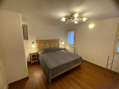 Letto o letti in una camera di Casa Rossa