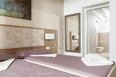 Letto o letti in una camera di Al Reparo
