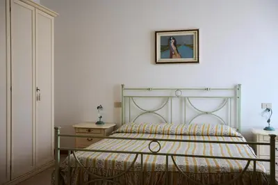 Letto o letti in una camera di Appartamento Olimpia-Centralissimo-Pochi passi dal mare
