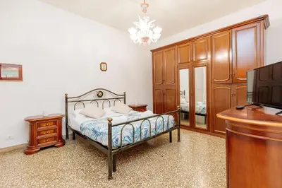 Letto o letti in una camera di Tipica casa Veneziana a 15 minuti dal centro AC e fast WIFI