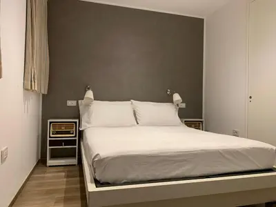 Letto o letti in una camera di Ca’ dei Pasi